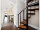 Hallway featuring hardwood floors, a spiral staircase, and neutral wall paint at 2917 Ashebrooke Ne Dr, Marietta, GA 30068