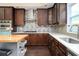 Well-equipped kitchen boasts wood cabinets, stainless appliances, and modern finishes at 2917 Ashebrooke Ne Dr, Marietta, GA 30068