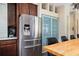 Modern kitchen boasts stainless steel refrigerator and ample dark wood cabinetry at 2917 Ashebrooke Ne Dr, Marietta, GA 30068