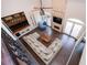 A spacious living room offering a full view of the brick fireplace, bar, vaulted ceilings, and hardwood floors at 2917 Ashebrooke Ne Dr, Marietta, GA 30068