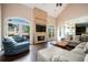 Bright living room featuring vaulted ceilings, a brick fireplace and french doors to the back porch at 2917 Ashebrooke Ne Dr, Marietta, GA 30068