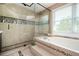 Luxurious bathroom with a soaking tub, large shower with tile, and custom fixtures at 2917 Ashebrooke Ne Dr, Marietta, GA 30068
