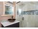 Renovated bathroom featuring a glass shower and modern fixtures at 2917 Ashebrooke Ne Dr, Marietta, GA 30068