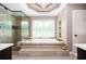 Luxurious bathroom with a soaking tub, large shower, and modern fixtures at 2917 Ashebrooke Ne Dr, Marietta, GA 30068