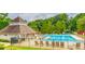 Community pool with lounge chairs and mature landscaping, perfect for relaxation and recreation at 2917 Ashebrooke Ne Dr, Marietta, GA 30068