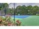 Community tennis court surrounded by lush greenery for recreational games at 2917 Ashebrooke Ne Dr, Marietta, GA 30068