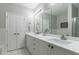 Elegant bathroom with double sinks, white cabinetry, and a well-lit vanity area at 3150 Woodwalk Se Dr # 2204, Atlanta, GA 30339
