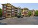 Attractive building exterior featuring a mix of brick and siding with covered balconies, and ample parking at 3150 Woodwalk Se Dr # 2204, Atlanta, GA 30339