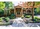 Inviting clubhouse featuring a stone facade, covered porch, and landscaped surroundings at 3150 Woodwalk Se Dr # 2204, Atlanta, GA 30339