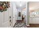 Welcoming entryway that leads to the living room and kitchen with hardwood floors and modern lighting at 3150 Woodwalk Se Dr # 2204, Atlanta, GA 30339