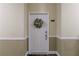 Inviting front door with a wreath; the door is decorated with a floral wreath at 3150 Woodwalk Se Dr # 2204, Atlanta, GA 30339