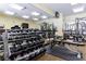 Well-equipped fitness center with weights, machines and mirrors at 3150 Woodwalk Se Dr # 2204, Atlanta, GA 30339