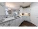 Well-lit kitchen with white cabinets, quartz countertops and stainless steel sink at 3150 Woodwalk Se Dr # 2204, Atlanta, GA 30339