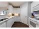 Well-lit kitchen featuring white cabinets, quartz countertops, and stainless steel appliances at 3150 Woodwalk Se Dr # 2204, Atlanta, GA 30339