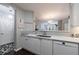 Kitchen featuring a breakfast bar, stainless steel sink, and white cabinets at 3150 Woodwalk Se Dr # 2204, Atlanta, GA 30339