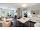 Bright and airy living room featuring a fireplace, dining area and hardwood floors at 3150 Woodwalk Se Dr # 2204, Atlanta, GA 30339