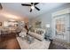 Open living space with modern decor, sleek furniture, and access to a private outdoor balcony at 3150 Woodwalk Se Dr # 2204, Atlanta, GA 30339