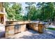 Stylish outdoor kitchen with a built-in grill, countertop space, and stainless steel appliances at 3150 Woodwalk Se Dr # 2204, Atlanta, GA 30339