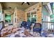 Cozy covered porch with stone flooring and decorative wicker chairs, perfect for relaxing at 3150 Woodwalk Se Dr # 2204, Atlanta, GA 30339