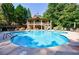 Community swimming pool with a sun deck and lounge chairs, perfect for relaxing and enjoying the outdoors at 3150 Woodwalk Se Dr # 2204, Atlanta, GA 30339