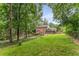 The large backyard is shaded with mature trees, and backs up to a wooded area at 3541 Castlehill Ct, Tucker, GA 30084