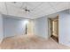 Basement with neutral carpet, drop ceiling, and several doors leading to storage or other rooms at 3541 Castlehill Ct, Tucker, GA 30084