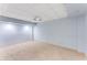 Spacious basement area with neutral carpet and drop ceiling, ready to be transformed at 3541 Castlehill Ct, Tucker, GA 30084