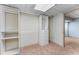 Finished basement storage room with custom shelving and carpeting at 3541 Castlehill Ct, Tucker, GA 30084