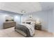 Basement bedroom with soft blue walls, neutral carpeting, and comfortable furnishings at 3541 Castlehill Ct, Tucker, GA 30084