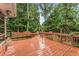 Spacious wood deck and bench seating overlooking a lush backyard at 3541 Castlehill Ct, Tucker, GA 30084