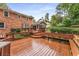 Large wood deck with bench seating overlooking green landscaped backyard at 3541 Castlehill Ct, Tucker, GA 30084