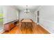 Dining room with wood floors, and neutral color paint, with views to outdoors at 3541 Castlehill Ct, Tucker, GA 30084