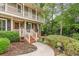 Close-up of home's front entrance and landscaped yard, walkway and traditional architectural style at 3541 Castlehill Ct, Tucker, GA 30084