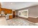Traditional kitchen with lots of cabinets and large window seat, tiled floors and stainless steel dishwasher at 3541 Castlehill Ct, Tucker, GA 30084