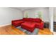 Comfortable living room featuring a large sofa and hardwood floors at 3541 Castlehill Ct, Tucker, GA 30084