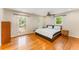 Spacious bedroom with hardwood floors, natural light, and a private balcony at 3541 Castlehill Ct, Tucker, GA 30084