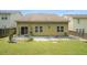 Spacious backyard with green lawn and patio, perfect for entertaining or relaxation at 7761 Parkside Dr, Lithia Springs, GA 30122