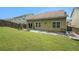 Home backyard with a patio, small pergola, lush lawn, and fencing at 7761 Parkside Dr, Lithia Springs, GA 30122