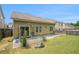 Backyard features a patio, lawn, and privacy fence for outdoor enjoyment at 7761 Parkside Dr, Lithia Springs, GA 30122
