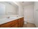 Well-lit bathroom features double sinks, vanity, and shower-tub combination at 7761 Parkside Dr, Lithia Springs, GA 30122