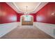 Formal dining room with wainscoting, a chandelier, and access to a built-in buffet at 7761 Parkside Dr, Lithia Springs, GA 30122
