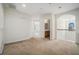 Upstairs hallway with carpet, arched window, and railing at 7761 Parkside Dr, Lithia Springs, GA 30122