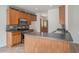 Kitchen featuring wood cabinets, stainless appliances, dark countertops and tiled backsplash at 7761 Parkside Dr, Lithia Springs, GA 30122
