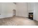 Large living room with high ceilings, fireplace and neutral carpet at 7761 Parkside Dr, Lithia Springs, GA 30122