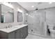Elegant bathroom with double vanity, glass-enclosed shower, and modern fixtures at 1940 Country Pl, Cumming, GA 30040