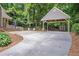 Long driveway leading to a detached carport and additional storage shed at 1940 Country Pl, Cumming, GA 30040