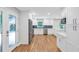 Spacious kitchen featuring white cabinetry, stainless appliances, and an exterior door to the deck at 1940 Country Pl, Cumming, GA 30040