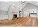 Open concept living room flowing into the kitchen, featuring a stone fireplace at 1940 Country Pl, Cumming, GA 30040