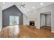Bright living room with fireplace, high ceilings, and hardwood floors at 1940 Country Pl, Cumming, GA 30040