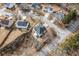 Aerial view of a single Gathering home in a suburban neighborhood featuring mature trees and well-maintained landscaping at 2885 Field Spring Dr, Lithonia, GA 30058
